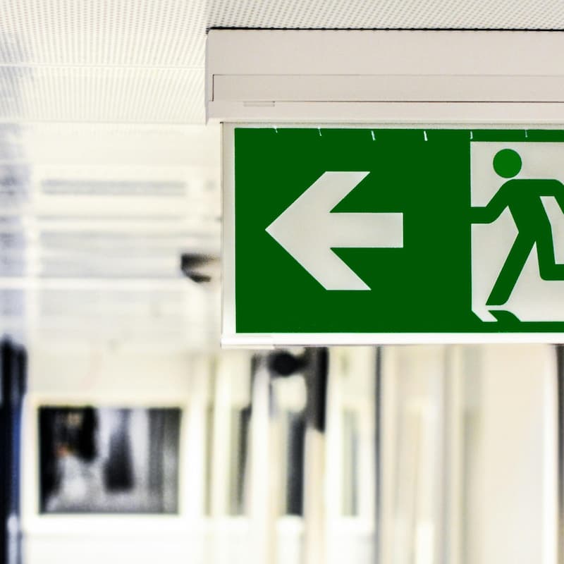 Emergency exit sign in green and white