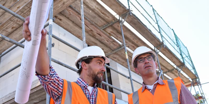 construction - two males wearinging orange vests.jpg (48 KB)