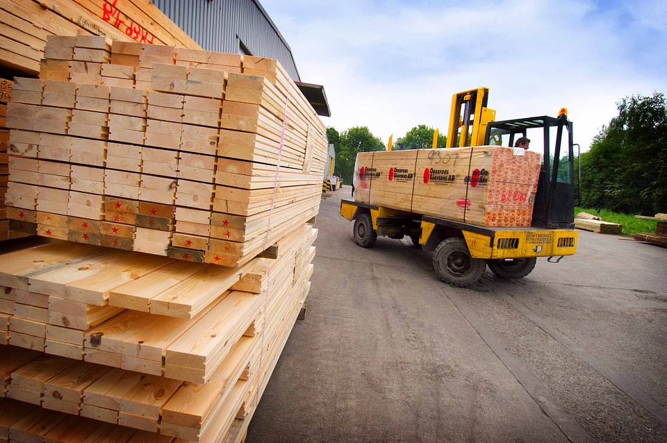 Construction material stacked and being transported by vehicle