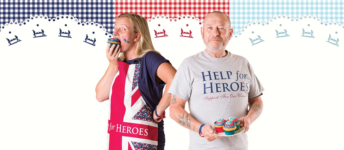 Bakers holding cupcakes at help the hero bake off