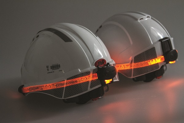 two white JSP safety helmets with illumination strip for extra safety