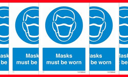 Blue and white icon of a male wearing a mask with wording displayed - masks must be worn.