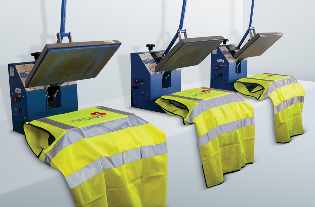 Three yellow hi-vis vests branded by branding machine