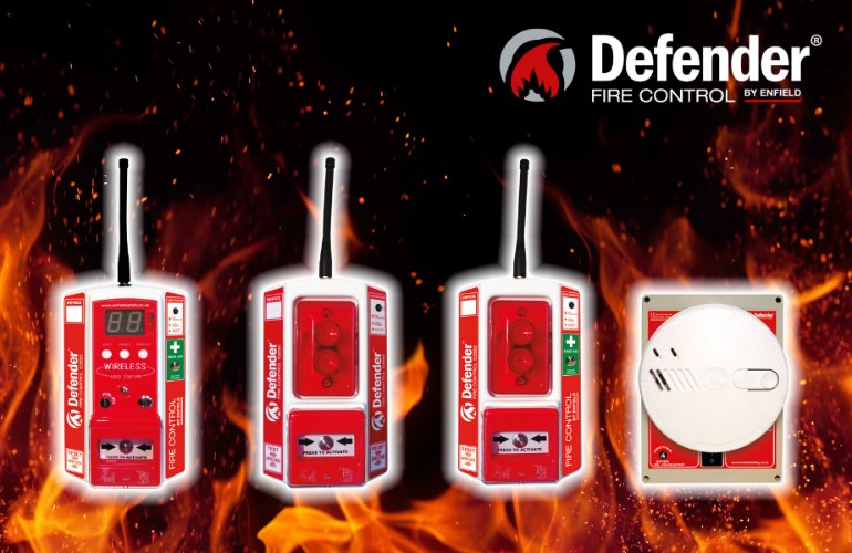 Display of four defender wireless fire alarm systems