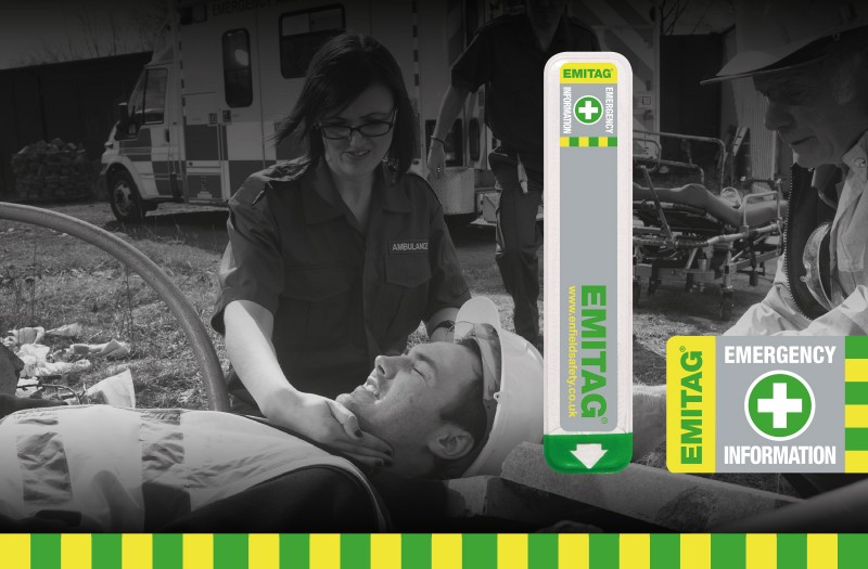 Site worker receiving medical help from paramedic with emitag sticker visable